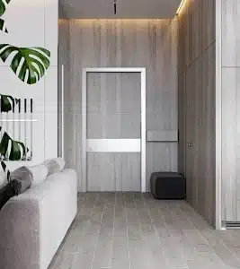 Pasillo minimalista con puerta blanco gris
